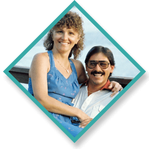 a man and woman are posing for a picture